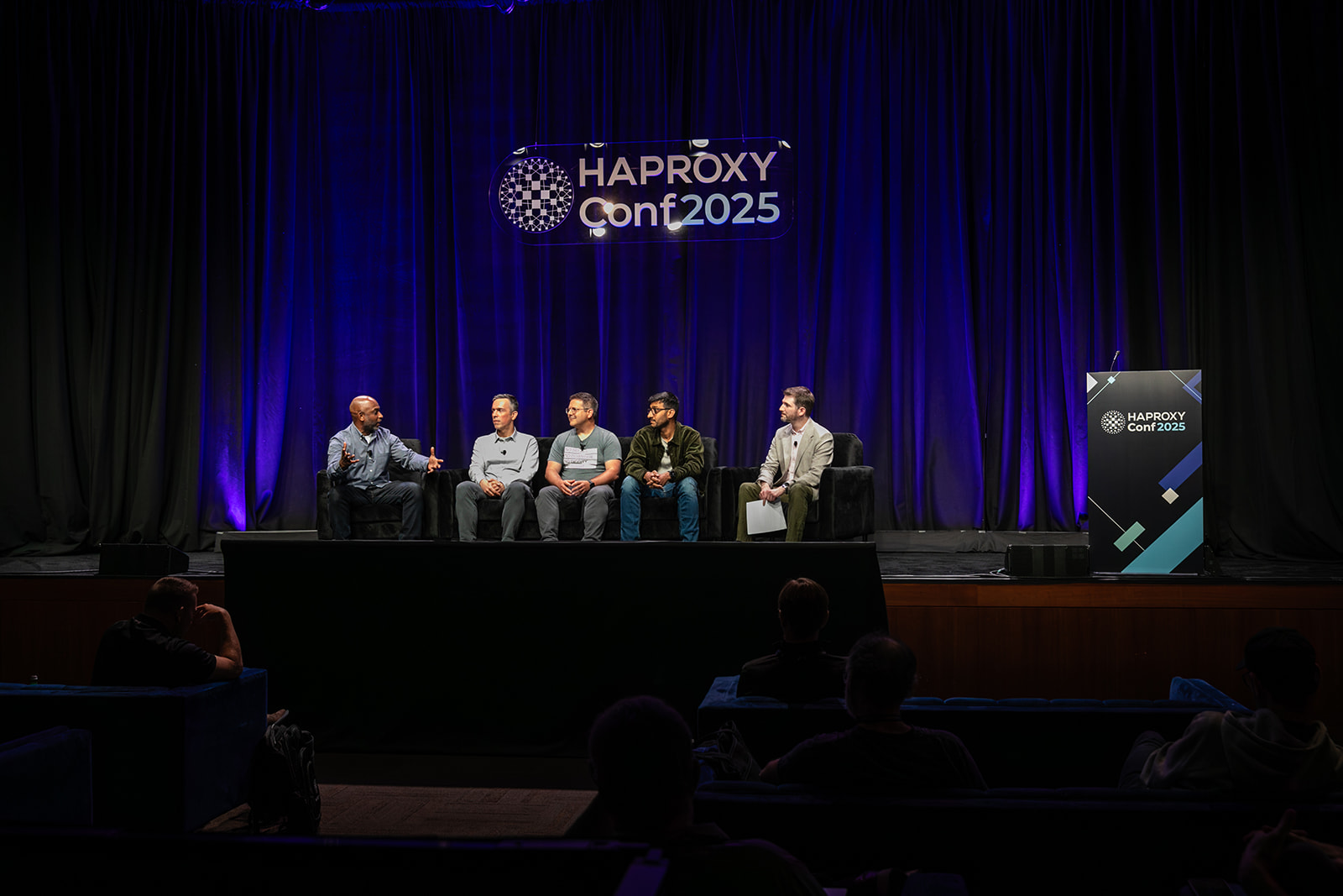 Panel discussion featuring Kelsey Hightower, Andjelko Iharos, Baptiste Assmann, and Hussein Nasser